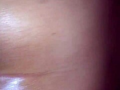 Oiled booty teases beautifully