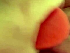 Shaved pussy penetrated by thick dildo toy