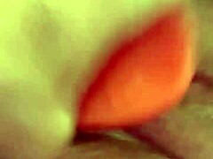 Shaved pussy penetrated by thick dildo toy