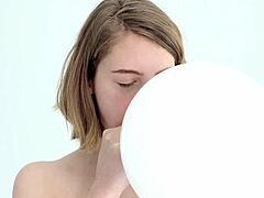Skinny blonde teen bursts balloon