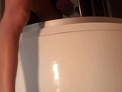 Solo guy stroking cock in steamy shower scene