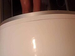 Solo guy stroking cock in steamy shower scene