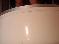 Solo guy stroking cock in steamy shower scene
