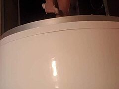Solo guy stroking cock in steamy shower scene