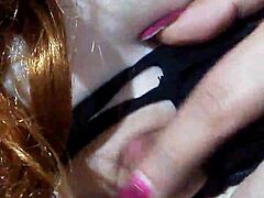 Masked mouth covered with black dildo thrust