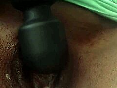Ebony babe teases her juicy clit with toys.