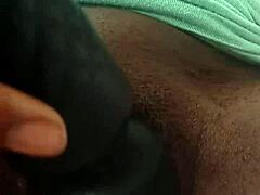 Ebony babe teases her juicy clit with toys.