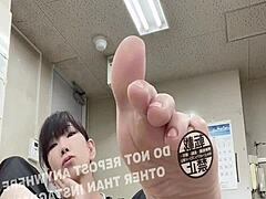 Asian office worker flaunts sexy feet