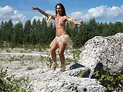 topless mature’s daring dance in quarry