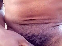 Moaning while stroking big black cock outdoors