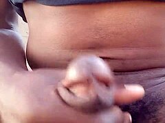 Moaning while stroking big black cock outdoors