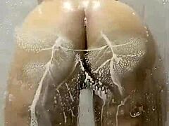 Latina Tempts with Dildo in Public Shower