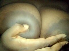 Ebony groping her busty aroused breasts on cam