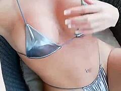 French Brunette Teases Herself In Shiny Silver Bikini
