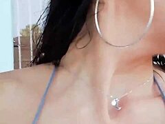 French Brunette Teases Herself In Shiny Silver Bikini