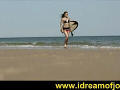 surfs up with a solo beach tease by brunette