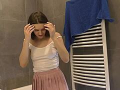 just caught my skinny brunette babe teasing in the bathroom with her pink mini skirt and sexy legs