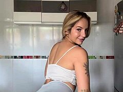this blonde amateur loves showing off her big ass and pierced nipples while shaking it
