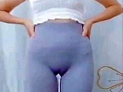 Hey, watch this Asian girl groove with a sexy cameltoe on display.