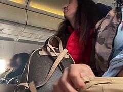 This cute teen brunette jerks off a guy on a packed plane. Risky public flashing unfolds in close-up POV.