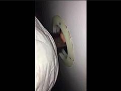 Blonde milf sucks stranger’s big cock through glory hole, disappointing skills.