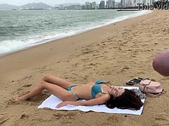 Babe flashes cock in public and begs for cum on tits at beach.