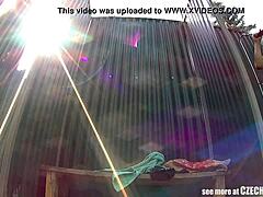 Brunette milf caught showering naked at public pool.