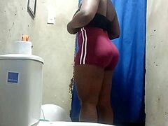 Amateur camera catches fat maid in bathroom getting busy
