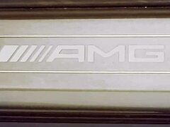 playboy babes in bikinis wash a mercedes amg gt. their big asses shine under the sun.