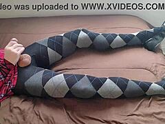 Shemale stroking hard in plaid dress and tights