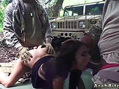 Hey, watch this petite Arab teen with strapon mistress outdoors in military uniform!