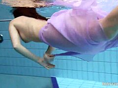 Aneta flaunts big tits in purple dress underwater in pool