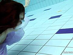 Aneta flaunts big tits in purple dress underwater in pool
