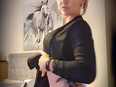blonde milf gives a little striptease to tease