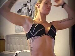 blonde milf gives a little striptease to tease