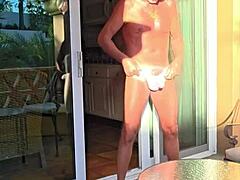creepy guy enjoys stretching thongs on his vacation balcony