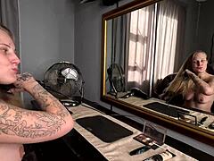 Hey, check this sexy tattooed blonde doing makeup totally naked! 😍