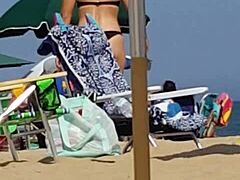 candid shots of this sneaky slut in bikini at beach