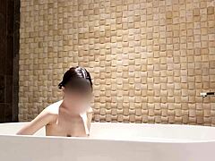 cute asian brunette enjoys solo bath time at luxury hotel with fetish vibes