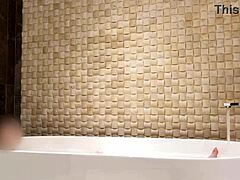 cute asian brunette enjoys solo bath time at luxury hotel with fetish vibes