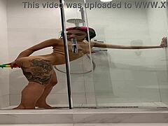 Naked Roxy rubs herself in steamy shower session