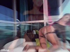 Busty Redhead Teases on Public Balcony with Stunning Moves