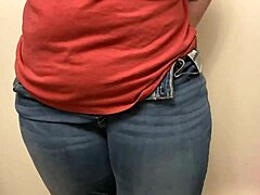struggling to squeeze into tight jeans with big assets