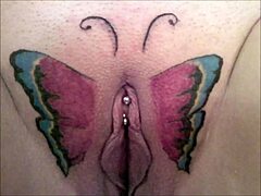 Crystal Butterfly flaunts intricate tattoo while rocking out to intense music vibes