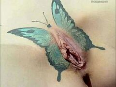 Crystal Butterfly flaunts intricate tattoo while rocking out to intense music vibes