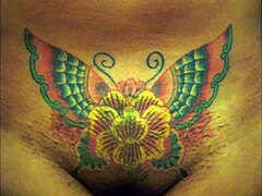 Crystal Butterfly flaunts intricate tattoo while rocking out to intense music vibes