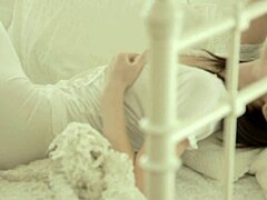 Fen O smiles casually while she explores her natural Asian body gently in a relaxed solo session.