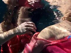 Lilia Mihalkova and Natalia Kupalka dive into underwater lesbian play in the pool