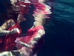 Lilia Mihalkova and Natalia Kupalka dive into underwater lesbian play in the pool