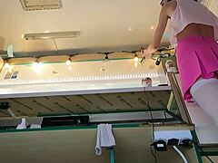 This 18-year-old brunette works extra cash gigs in white stockings, pearl thong, pink mini skirt, and goes braless.